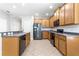 Spacious kitchen with stainless steel appliances, ample cabinetry, and tile flooring at 7725 Tangle Rush Dr, Gibsonton, FL 33534