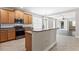 Well-equipped kitchen with modern appliances and a convenient breakfast bar at 7725 Tangle Rush Dr, Gibsonton, FL 33534