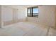 Spacious bedroom with a large window offering a scenic view at 9415 Blind Pass Rd # 1201, St Pete Beach, FL 33706