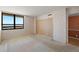 Bright bedroom featuring a large window with scenic waterfront view at 9415 Blind Pass Rd # 1201, St Pete Beach, FL 33706