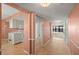 Welcoming hallway featuring tile floors, closet, and access to the kitchen and living area at 9415 Blind Pass Rd # 1201, St Pete Beach, FL 33706