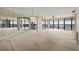 Bright living room with large windows offering panoramic views and lots of natural light at 9415 Blind Pass Rd # 1201, St Pete Beach, FL 33706
