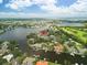 Waterfront home showcasing scenic views from the water, with lush green landscaping and an island view at 944 31St Ne Ter, St Petersburg, FL 33704