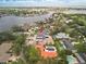 Aerial view of a modern two-story home with a waterfront view surrounded by lush landscaping at 944 31St Ne Ter, St Petersburg, FL 33704