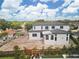 Aerial of a modern two-story home surrounded by trees and landscaping with an unfinished yard at 944 31St Ne Ter, St Petersburg, FL 33704