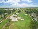 Scenic golf course community with sand bunkers, lush greens, and palm trees at 944 31St Ne Ter, St Petersburg, FL 33704