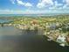 Gorgeous waterfront home with lush green landscaping, scenic views from the water, and proximity to a golf course at 944 31St Ne Ter, St Petersburg, FL 33704