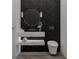 Sleek bathroom with a marble vanity, vessel sink, round mirror, and minimalist design at 944 31St Ne Ter, St Petersburg, FL 33704