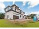 Modern home showing two stories, new construction, and a two-car garage with clean lines and bright windows at 944 31St Ne Ter, St Petersburg, FL 33704