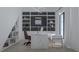 A modern home office featuring custom shelving, a large desk, and stylish decor at 944 31St Ne Ter, St Petersburg, FL 33704