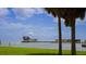 Modern waterfront architecture with palms, docks, and open water views under a blue sky at 944 31St Ne Ter, St Petersburg, FL 33704