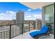 Relaxing balcony with a comfortable lounge chair and stunning city views at 100 1St N Ave # 2207, St Petersburg, FL 33701