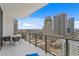 Spacious balcony with city views, modern seating, and glass railings at 100 1St N Ave # 2207, St Petersburg, FL 33701