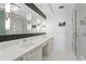 Modern bathroom with dual sinks, sleek fixtures, and walk-in shower at 100 1St N Ave # 2207, St Petersburg, FL 33701