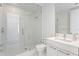 Bright bathroom featuring a glass-enclosed shower, modern fixtures, and marble-style tile at 100 1St N Ave # 2207, St Petersburg, FL 33701