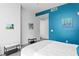 Bright bedroom with minimalist decor and stylish accent wall and neutral furniture at 100 1St N Ave # 2207, St Petersburg, FL 33701
