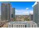 Expansive city view featuring modern high-rise buildings under a vibrant blue sky with scattered clouds at 100 1St N Ave # 2207, St Petersburg, FL 33701