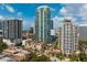 Beautiful aerial view of the city with lush greenery and buildings set against a partly cloudy sky at 100 1St N Ave # 2207, St Petersburg, FL 33701