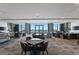 Well-appointed conference room with comfortable seating, tables, and stunning waterfront views at 100 1St N Ave # 2207, St Petersburg, FL 33701