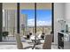 Modern dining room with glass table and city views, perfect for entertaining guests at 100 1St N Ave # 2207, St Petersburg, FL 33701