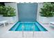 Inviting hot tub with mosaic tile backdrop and lush greenery for a tranquil spa experience at 100 1St N Ave # 2207, St Petersburg, FL 33701