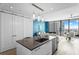 Open concept kitchen with island, stainless steel dishwasher, and city skyline view at 100 1St N Ave # 2207, St Petersburg, FL 33701