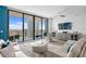 Open-concept living area with floor-to-ceiling windows and a city view at 100 1St N Ave # 2207, St Petersburg, FL 33701