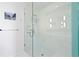 Walk-in shower features modern fixtures and marble surround at 100 1St N Ave # 2207, St Petersburg, FL 33701