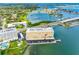 Beautiful waterfront condo building with lush landscaping and bay access, offering scenic views at 100 Bluff View Dr # 404C, Belleair Bluffs, FL 33770