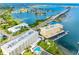 Stunning aerial view of waterfront condo complex with a pool and breathtaking water views at 100 Bluff View Dr # 404C, Belleair Bluffs, FL 33770