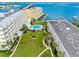 The waterfront community has a pool, grassy areas, and sidewalks to the complex by the bay at 100 Bluff View Dr # 404C, Belleair Bluffs, FL 33770
