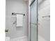 Bright bathroom features a walk-in shower with white tiles and updated fixtures at 100 Bluff View Dr # 404C, Belleair Bluffs, FL 33770