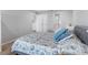 Tastefully decorated bedroom with gray walls, modern furniture, and light wood flooring at 100 Bluff View Dr # 404C, Belleair Bluffs, FL 33770