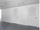 Hallway view featuring white doors with numbers 19 and 28 at 100 Bluff View Dr # 404C, Belleair Bluffs, FL 33770