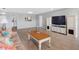 Well-lit living room with neutral tones, a comfortable couch, and a seamless dining area, perfect for relaxation at 100 Bluff View Dr # 404C, Belleair Bluffs, FL 33770