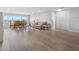 Bright, open floor plan with updated flooring, a dining area, and comfortable living space at 100 Bluff View Dr # 404C, Belleair Bluffs, FL 33770