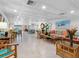 Spacious lounge area with bright decor, tile floors, inviting furniture, and natural light, great for relaxation at 100 Bluff View Dr # 404C, Belleair Bluffs, FL 33770