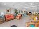 Inviting lounge area with comfortable wicker seating, tile floors, and a unique, textured ceiling at 100 Bluff View Dr # 404C, Belleair Bluffs, FL 33770