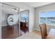 Bright office space with sliding door, water views, and desk at 100 Bluff View Dr # 404C, Belleair Bluffs, FL 33770