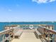 Picturesque pier view with benches, scenic harbor views and bright blue skies at 100 Bluff View Dr # 404C, Belleair Bluffs, FL 33770