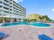 Outdoor pool with sun loungers and views of the nearby intercoastal waterway at 100 Bluff View Dr # 404C, Belleair Bluffs, FL 33770