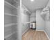 Spacious walk-in closet equipped with ventilated shelving and an efficient water heater at 100 Bluff View Dr # 404C, Belleair Bluffs, FL 33770