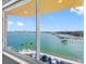 Wide view of a waterfront community with piers and docks from condo window at 100 Bluff View Dr # 404C, Belleair Bluffs, FL 33770