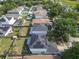 Aerial view of houses with solar panels, lush green lawns, and well-maintained fencing at 10337 River Bream Dr, Riverview, FL 33569