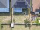 Aerial view of the backyard, showcasing outdoor living space, including a shed, and a partially shaded area at 10337 River Bream Dr, Riverview, FL 33569