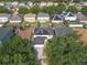 Aerial view showcasing the property's location in a community with mature trees and nearby amenities at 10337 River Bream Dr, Riverview, FL 33569