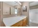 Bathroom featuring a long vanity with a large mirror and a walk-in shower at 10337 River Bream Dr, Riverview, FL 33569