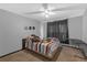 Bedroom with carpet, ceiling fan, and a black window curtain at 10337 River Bream Dr, Riverview, FL 33569