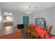 Features a chandelier, wood table with six chairs and a vintage blue armoire at 10337 River Bream Dr, Riverview, FL 33569