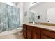 Bathroom with a decorative shower curtain, vanity, and tile floors at 10536 Shady Preserve Dr, Riverview, FL 33579